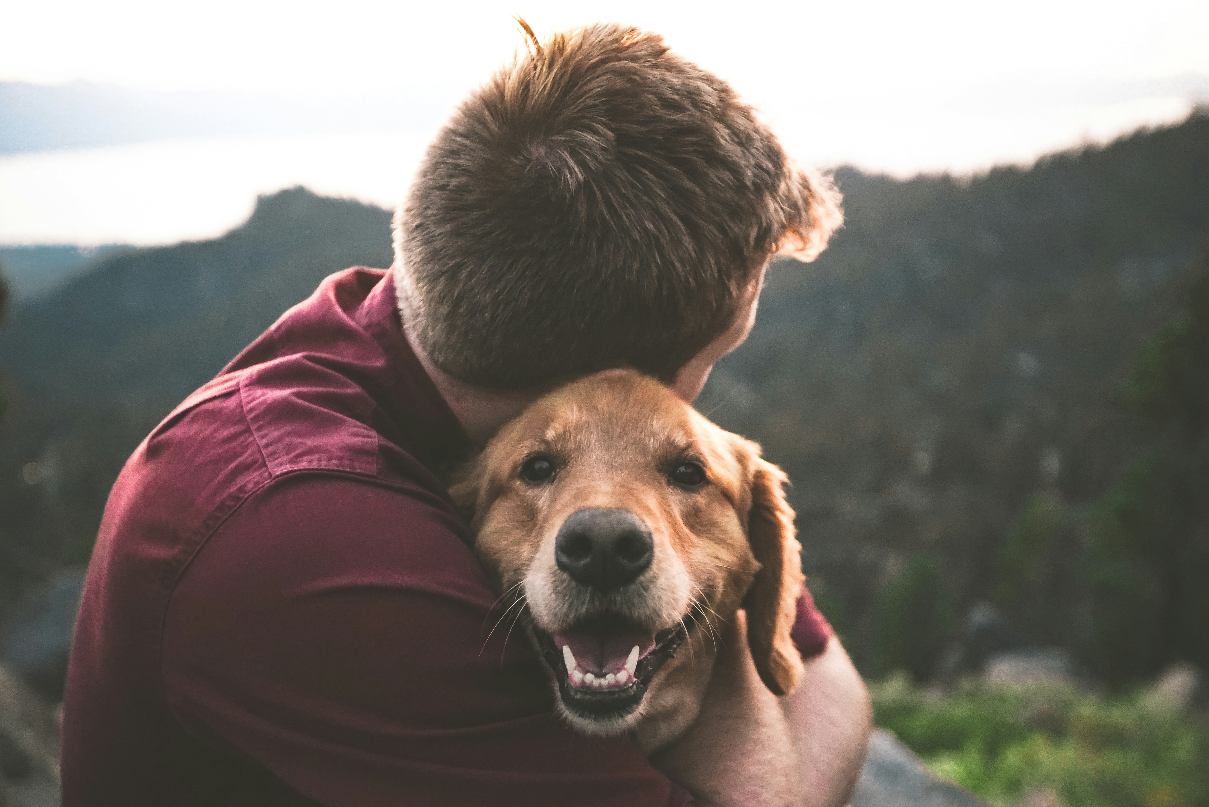 Happy dog owner with golden retriever
